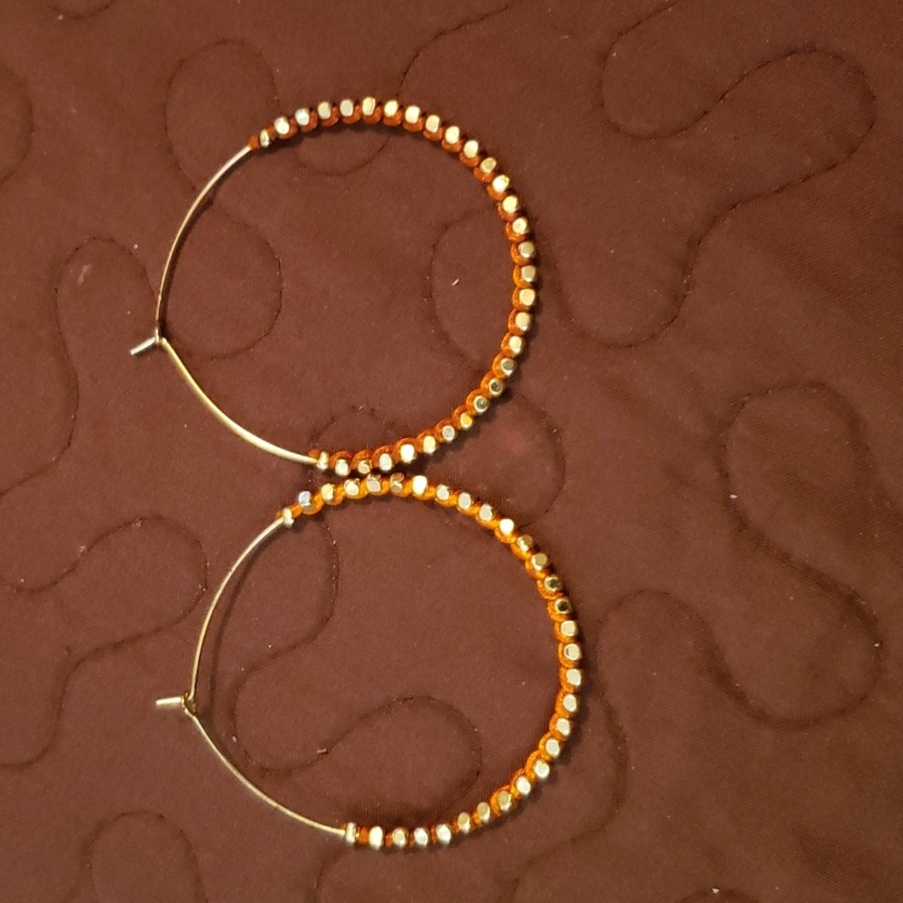 Thin gold with orange earrings.